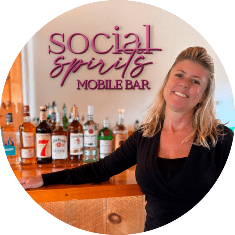 Courtney, founder of Social Spirits, standing next to the bar